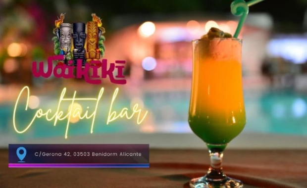 One of Waikiki's cocktails and address displayed under the bar's logo