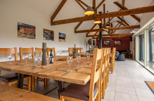 A photo of the large dining table in The Vaults 