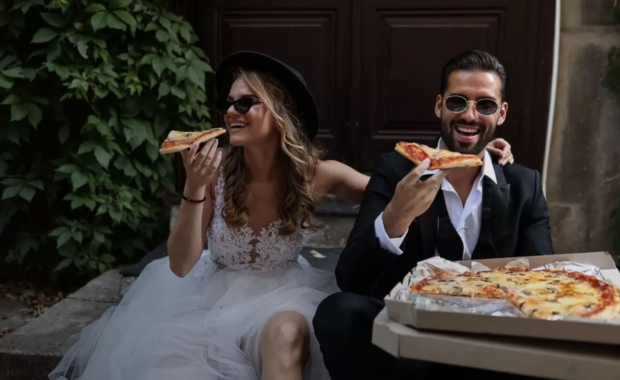 A newly-wed couple enjoying pizzas provided by Big Kahuna Streetfood