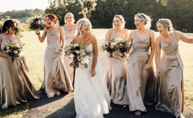 Bride and bridesmaids wearing dresses by Boutique Brides of Crosby