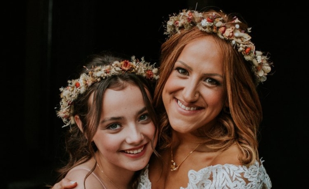 Two women posing with make-up done by Hannah Carson 